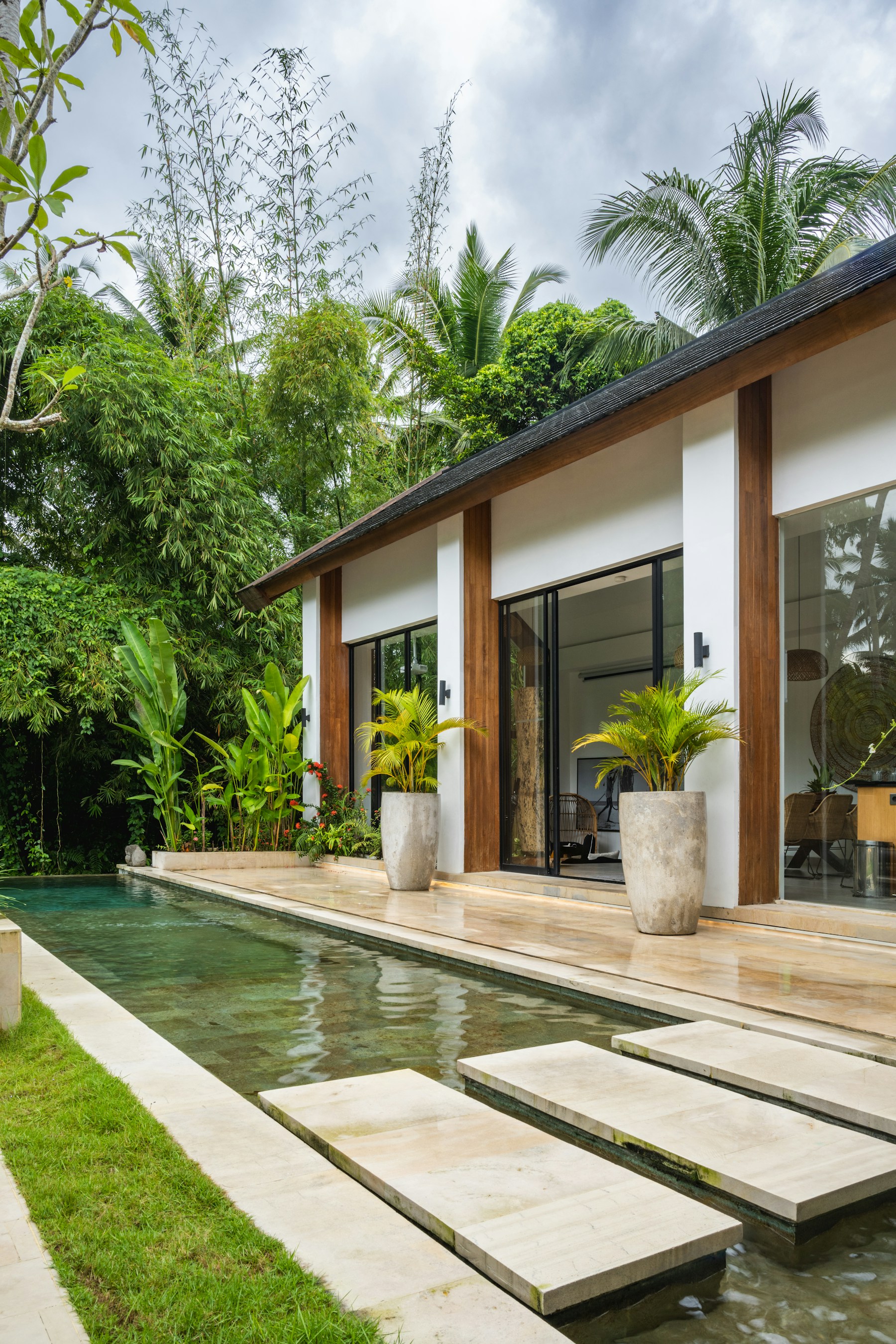 Modern home with glass doors and a swimming pool